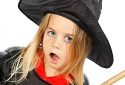Halloween witch, child in costume with her broom