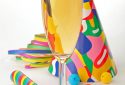 champagne and party with paper ribbon, confetti, ball blowers and party hats