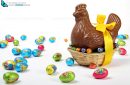 basket with a chocolate Easter hen , yellow ribbon and eggs, isolated on white background
