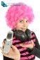 Young girl  with pink hair shows her old cellphone