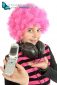Young girl  with pink hair shows her old cellphone