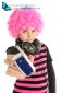 Young girl with pink hair shows a vintage telephone