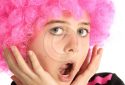 Portrait of young girl with pink hair say oh with his hand