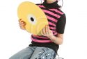 Child with pink hair and large CD disk