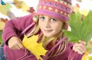 Autumnal mood of  happy girl with autumn leaves