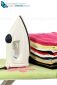 A steam iron on an ironing board and white background