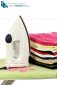 A steam iron on an ironing board and white background