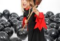 Young girl with her broom for halloween