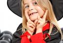 Halloween portrait of a child in a witch costume