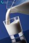 jug of creamy milk poured into a glass