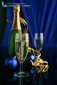champagne and gold ribbon on dark background