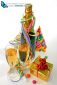 bottle and glass of champagne, paper ribbon, confetti, party hats and gifts on white background.