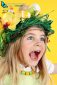 young girl with funny hairstyle on yellow background happy to celebrate Easter