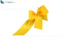 yellow ribbon and bow cut out and isolated on white background