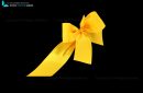 yellow bow and ribbon cut out and isolated on black background