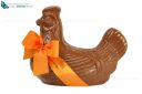 Easter chicken with ribbon and bow, cut out and isolated on a white background