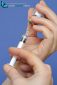Nurse hands close-up holding preparing a syringe with a dose of coronavirus covid 19 vaccine
