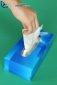 A woman's hand taking a white handkerchief out of a hygiene and health box